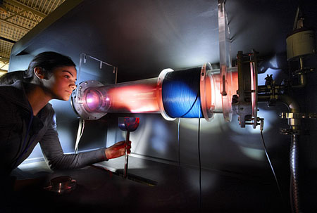 Researcher working on plasma measurement.
